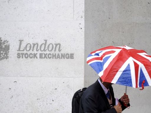 London's FTSE 100 nudges higher on rate optimism