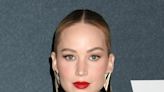 Jennifer Lawrence Dons Off-The-Shoulder Dior Dress For WWD Red Carpet