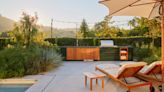 This tiled outdoor "kitchen island" was designed to blend in, but it's the stand-out of this Californian backyard
