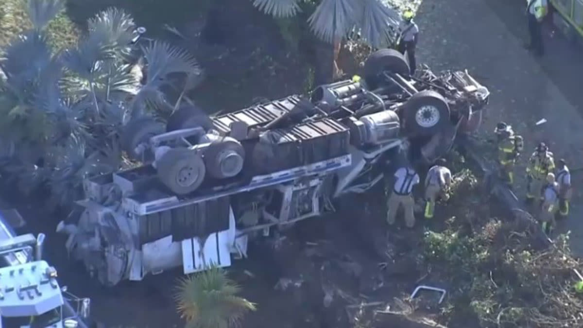 Vacuum truck driver hospitalized after rollover crash on Don Shula Expressway