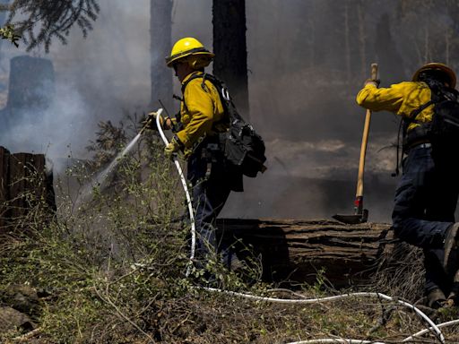 Firefighters make progress against massive blaze in California ahead of warming weather