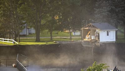 Erosion continues after rain-swollen Blue Earth River claims home near Rapidan Dam