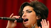 Amy Winehouse's parents, Mitch and Janis, accept her BRIT Award