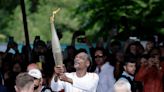 Snoop Dogg carries Olympic torch ahead of Paris opening ceremony