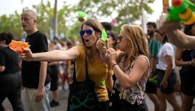 Barcelona anti-tourism protesters fire water pistols at visitors