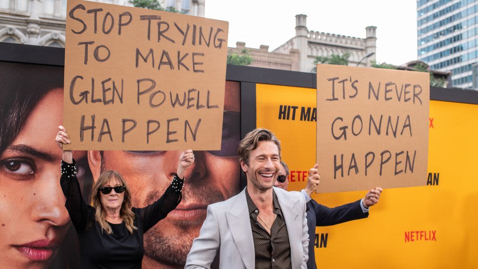 Glen Powell gets trolled by his parents at a screening of ‘Hit Man’