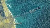 First aid shipment driven across newly built US pier into the Gaza Strip