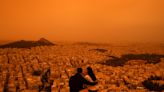 Skies turn orange over Athens as hot Saharan dust sweeps Mediterranean