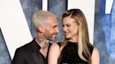 Behati Prinsloo shares rare family vacation pics, featuring Adam Levine holding their baby