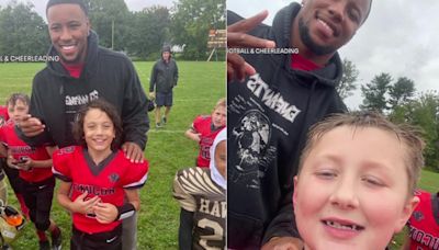 Saquon Barkley poses for pictures at Pennsylvania youth football scrimmage