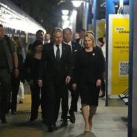 US Secretary of State Antony Blinken walks with US Ambassador to Ukraine Bridget Brink as he departs Kyiv on a train to Poland