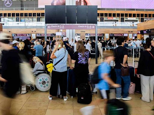 'Bedlam': Grounded flights and check-in chaos at airports all over Europe due to major IT outage