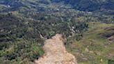 Papua New Guinea’s prime minister visits the site of a landslide estimated to have killed hundreds