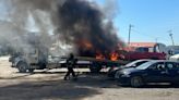 Vehicle carrier fire destroys 2 cars