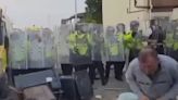 Moment rioter is hit in head with brick then in groin during violent clashes in Southport