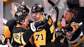 Malkin, Penguins surge past Flames with 5 goals in the third period for a 5-2 win