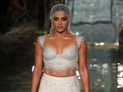 Wamiqa Gabbi Captivates in Abu Sandeep's Ivory Trail Lehenga and Webbed Headgear On Day 1 of ICW 2024 - News18