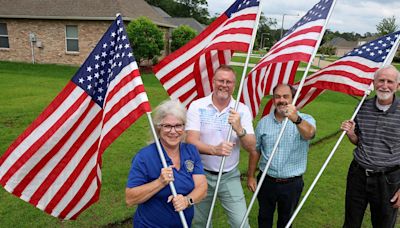 A red, white and blue Rotary salute