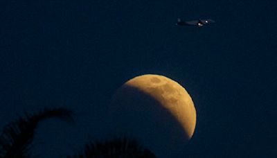 How to see Tuesday night's harvest supermoon and partial lunar eclipse