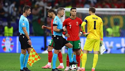 Fans mock linesman for running on the pitch in Portugal match