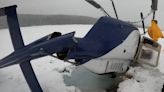 Pilot escapes with minor injuries after upside-down helicopter crash on frozen lake