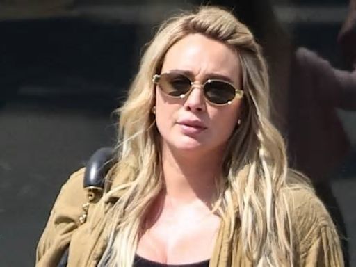 Pregnant Hilary Duff holds hands with daughters Banks, 5, and Mae, 3, during shopping spree at Claires... after husband Matthew Koma underwent a vasectomy