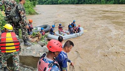 Nepal: 14 bodies found after buses swept into river by landslide, officals say