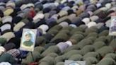 Iranians attend Friday noon prayer in Tehran, after explosions in the central region of the country
