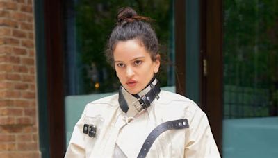 Rosalia layers an ivory moto jacket over a white maxi dress as she steps out solo in New York City