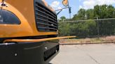Car runs red light, hits Charlotte school bus