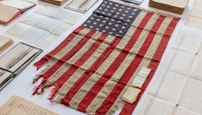 Shrapnel-scarred US flag from D-Day ship on sale