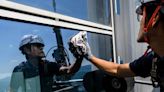 Photos: South Korea's skyscraper window cleaner with a fear of heights