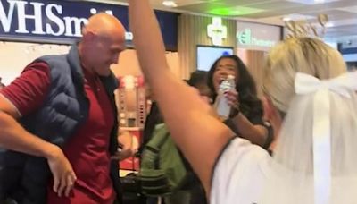 Tyson Fury dances with a hen do party and pretends to strip