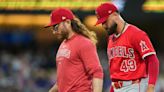 After Sandoval exits with arm injury, Angels respond with win in extras