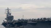 US orders aircraft carrier to stay near Taiwan as Chinese planes and ships deploy near the island and missiles fly in response to Pelosi's visit