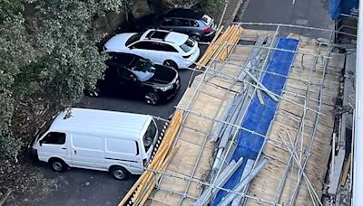 Woman miraculously escapes after wall of scaffolding fell on her car