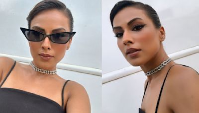 Nia Sharma oozes hotness in a black baggy mini dress and shows off her impeccable liner skills; See here