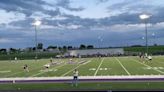 View of a boys lacrosse faceoff at Waunakee