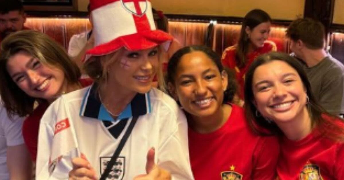 Amanda Holden flashes risks wrath of locals as she dons England shirt in Spain