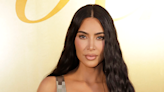 Kim Kardashian is giving Bride of Dracula with these perfectly parted curtain bangs