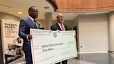 Rep. Bennie Thompson presents checks to support Jackson State, Tougaloo College programs