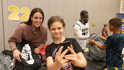 Caitlin Clark surprises Des Moines students with selfies and school supplies