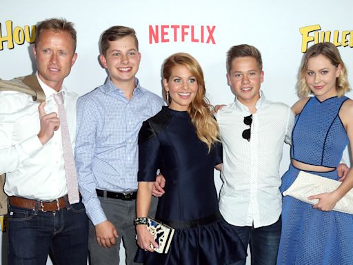 Candace Cameron Bure's 2 adult sons tower over her in cute family photo