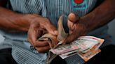 Rupee inches up on foreign banks' dollar sales, uptick in Asia FX