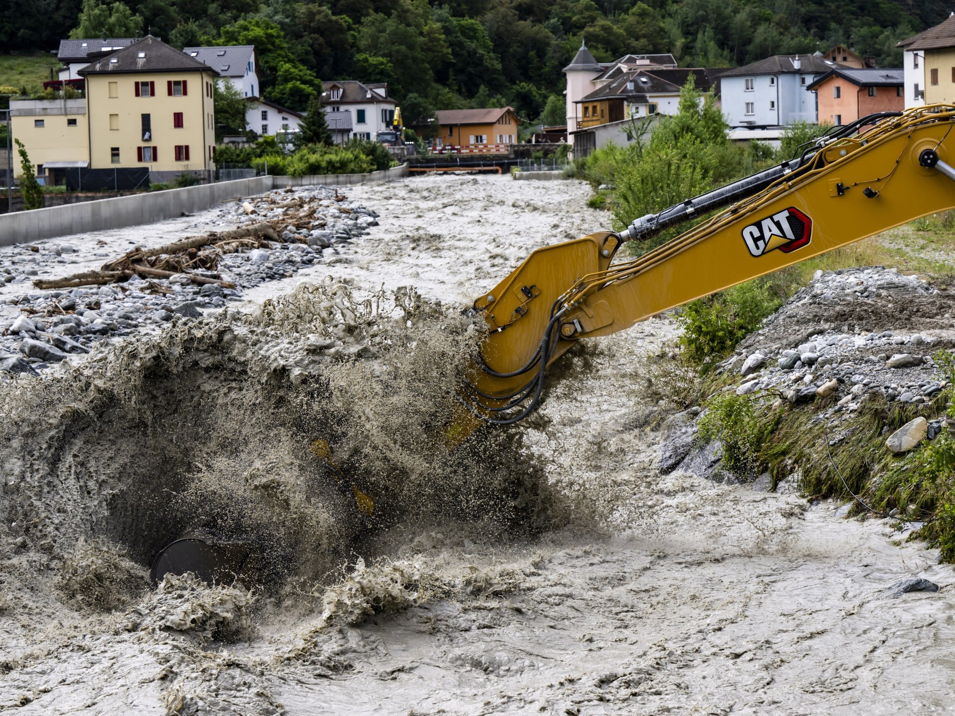 3 missing in a landslide in Swiss Alps as heavy rains cause flash floods