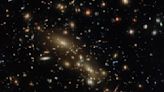 Hubble Space Telescope spies multiple galaxy clusters masquerading as one (image)