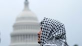 Hundreds of pro-Palestinian protesters rally in the rain in DC