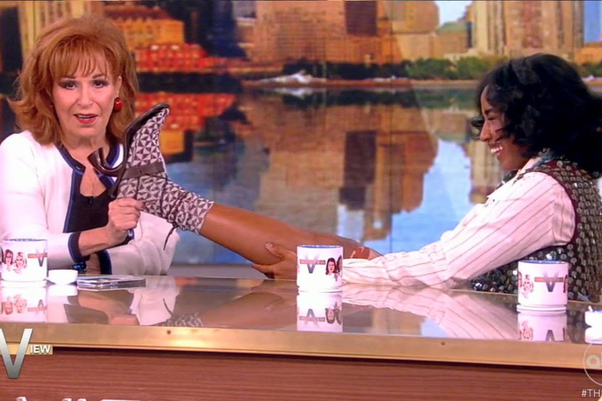 Joy Behar bizarrely holds Ayo Edebiri's foot on 'The View's Hot Topics table: "I'm not releasing her!"