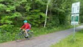 Hikers and cyclists can now cross Vermont on New England’s longest rail trail, a year after floods