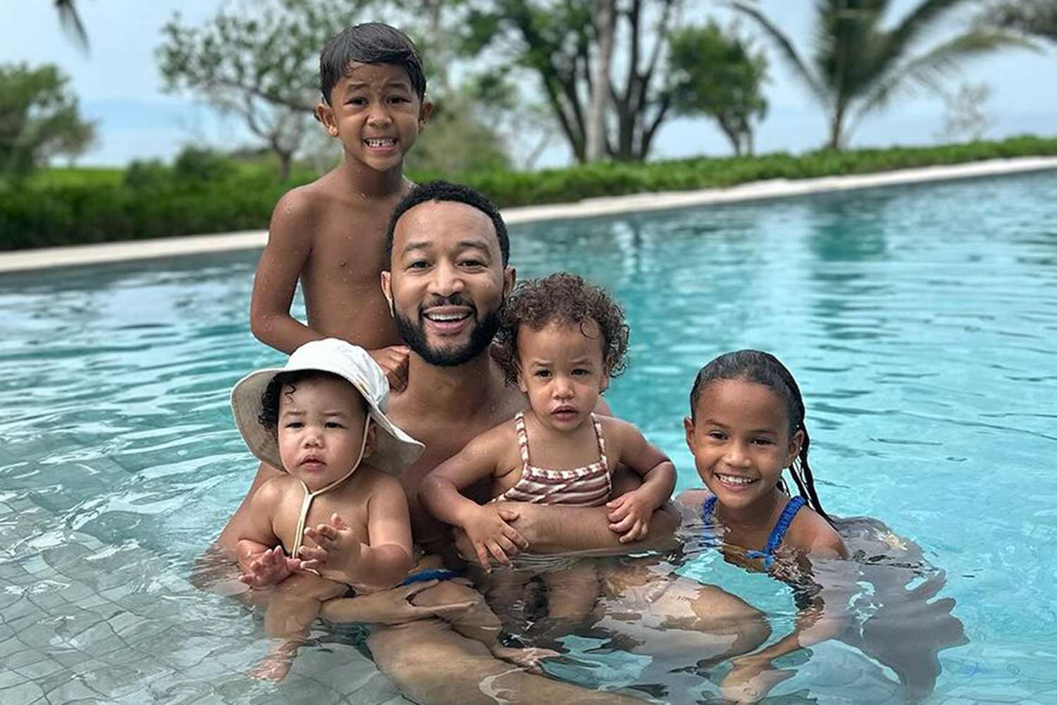 John Legend Cools Down in the Pool with His 'Babies' During Mexico Family Vacation